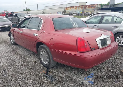 1999 Lincoln Town Car Signature z USA, uszkodzony, nr VIN 1LNFM82WXXY601583